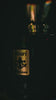 Nirari Eau de Parfum, the bottle turning in low light